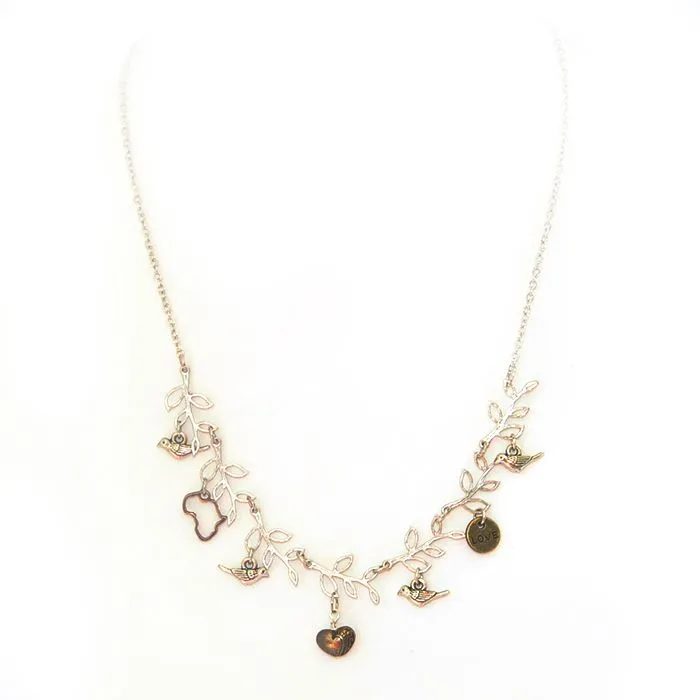 Antique brass and silver coloured metal charm necklace on fine chain - NWLN28