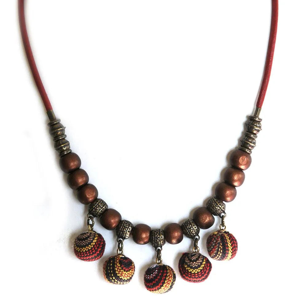 Fabric baubles with antique brass and metallic wood on leather - NWE176