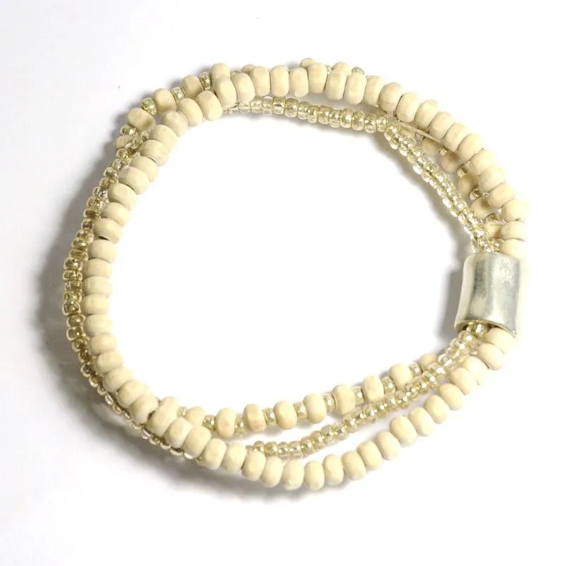 Off-white wood with silver coloured glass, 3 strand bracelet with elegant metal feature - BRE175