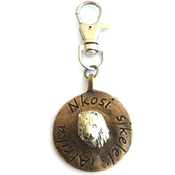 Lion image on antique brass disc with bag clip attachment - BC02