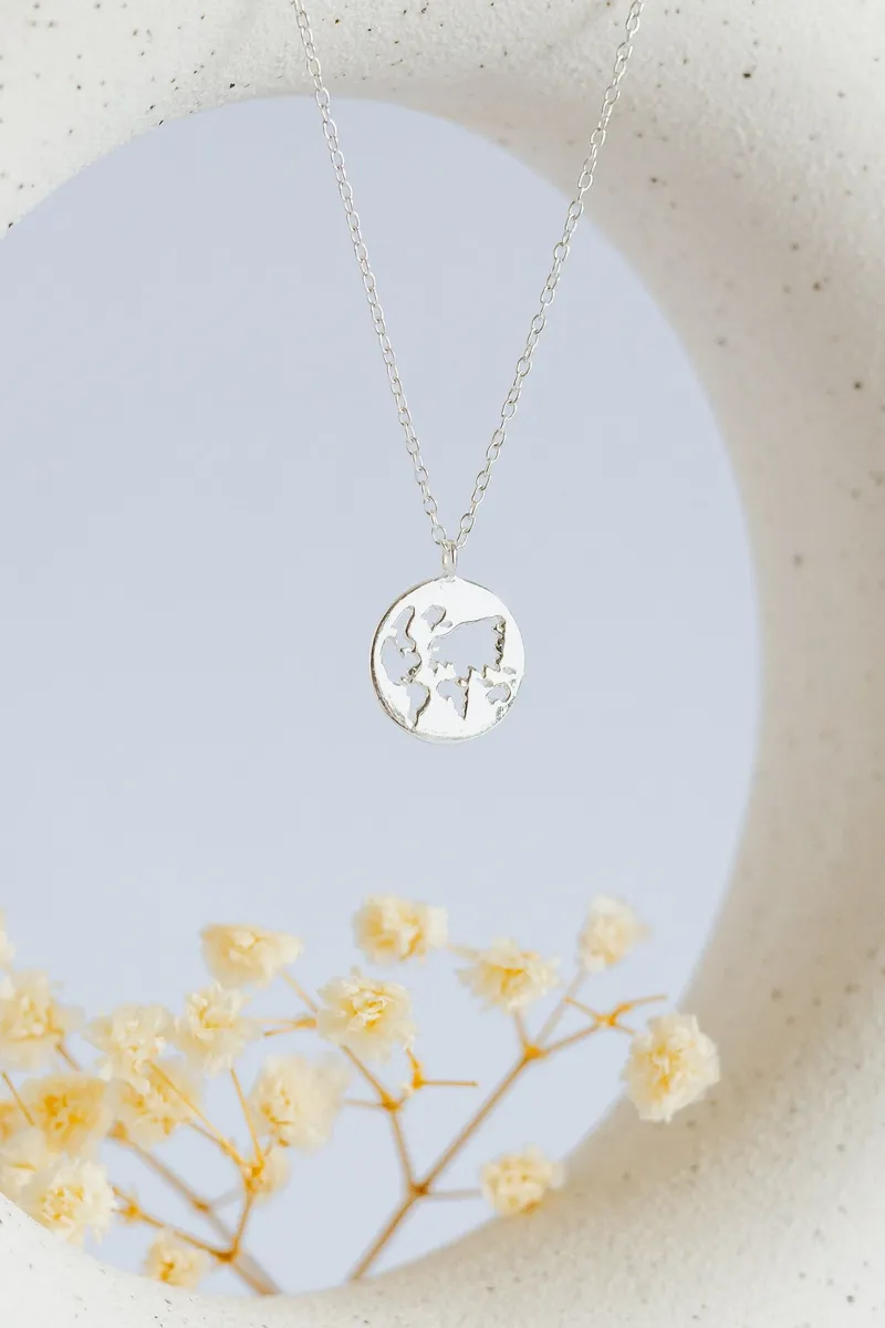 World Map Cutout Pendant - Image 1