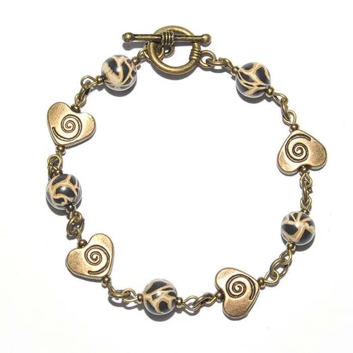 Animal skin polymer clay bracelet with antique brass hearts - BRAAB