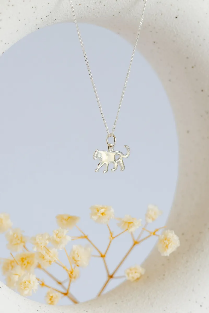 Leopard Pendant with Heart Cutout - Image 1