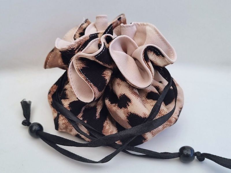 A light and compact travel cheetah print jewellery bag – JB10