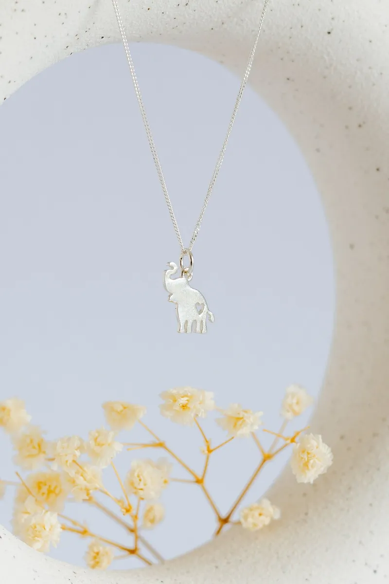 Elephant Trunk Up Pendant with Heart Cutout - Image 1