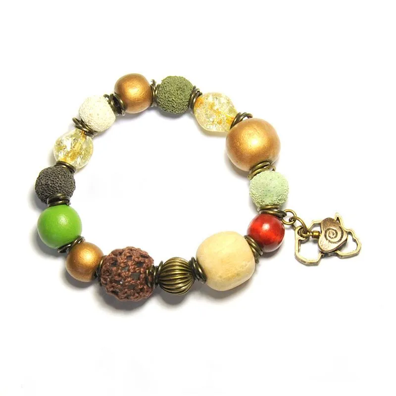 Antique brass heart & Africa with assorted beads on elastic - BRE96