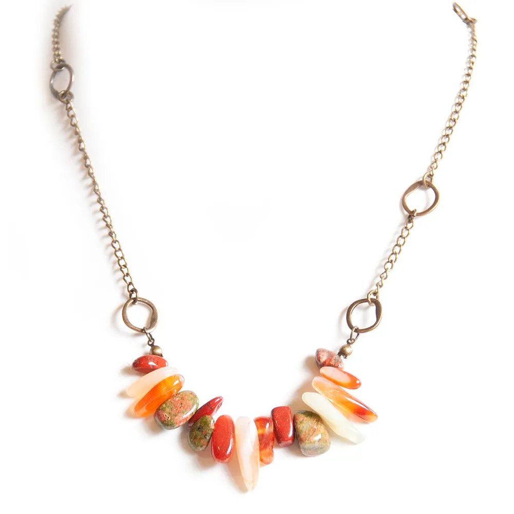A gemstone tumble of aloe shades on an antique brass chain - NWAL01