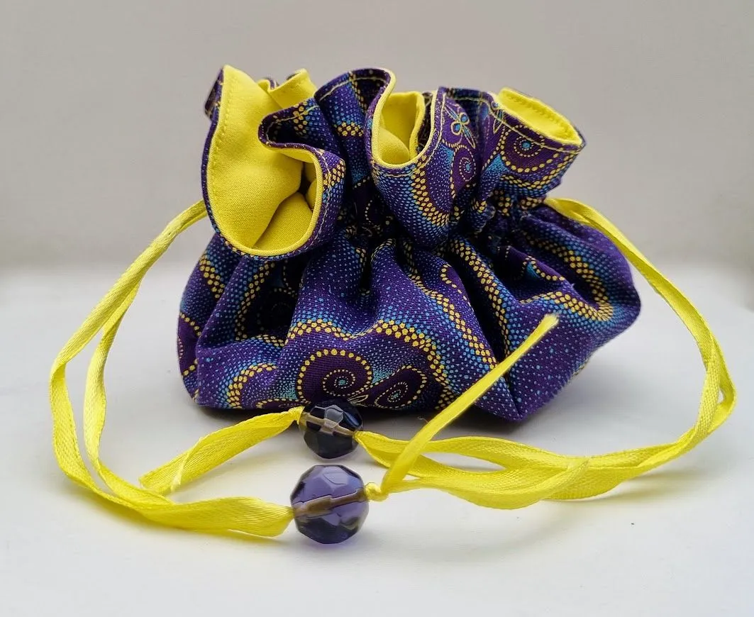 A light and compact travel jewellery bag in vibrant colours of purple and yellow - JB01