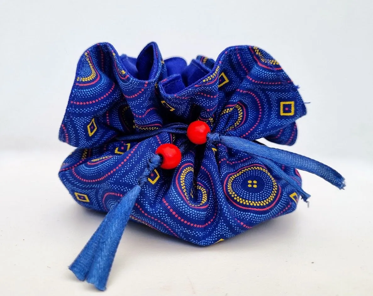 A light and compact travel jewellery bag in blue schwe schwe with red wooden beads – JB04