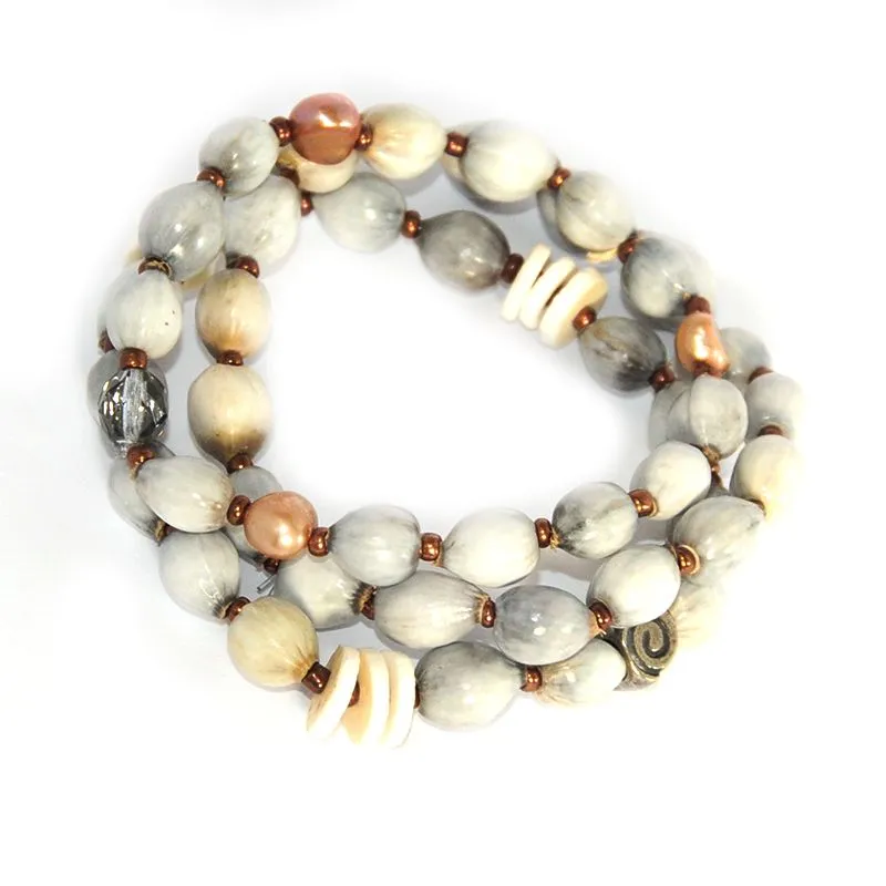 3 separate bracelets on elastic; Zulu seeds, ostrich eggshell, freshwater pearls - BRE90