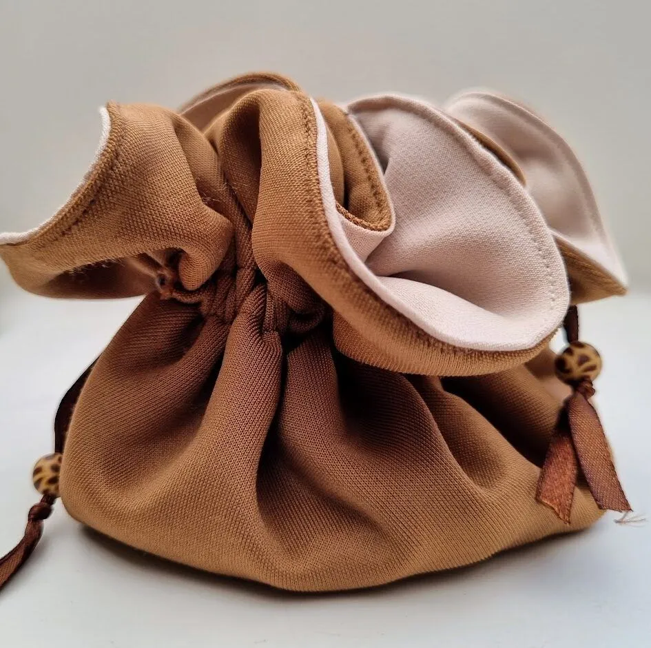 A light and compact travel jewellery bag in neutral colours with giraffe patterned polymer clay beads - JB08