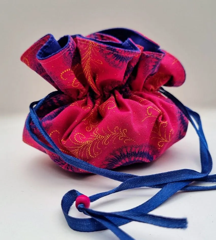 A light and compact travel jewellery bag in pretty shades of pink and blue – JB03